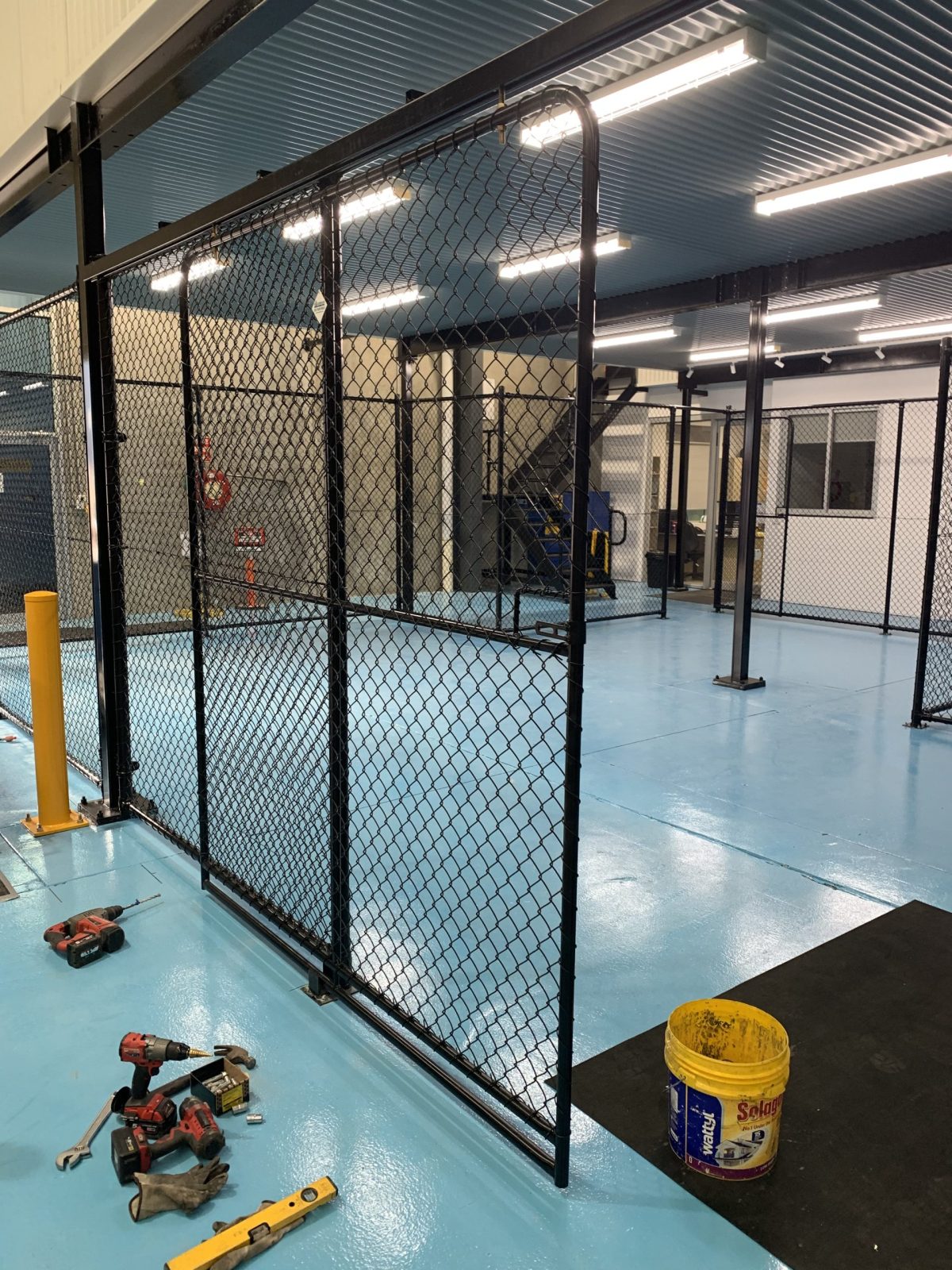 Chainmesh fencing solutions by Guardian Fencing for directing traffic, creating safety barriers, and securing warehouse areas. Ideal for pallet racking, bond stores, aerosol storage, and custom internal fencing.