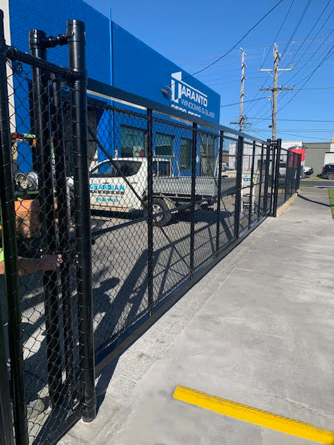 Industrial gate fabrication by Guardian Fencing, featuring a custom-designed, durable entrance gate.