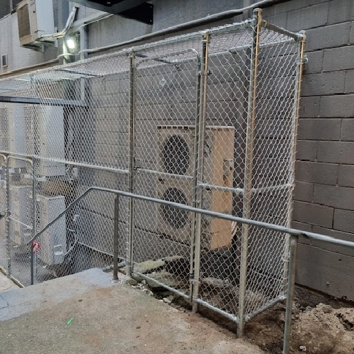 Fenced equipment by the stairs Fenced equipment by the stairs