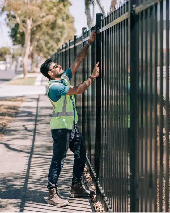 Man installing fence