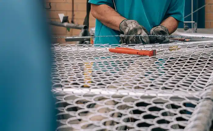 Man working on fence